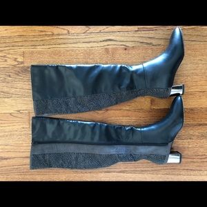 Tall black full zip boot. Design up the back